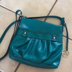 Basically new teal crossbody purse